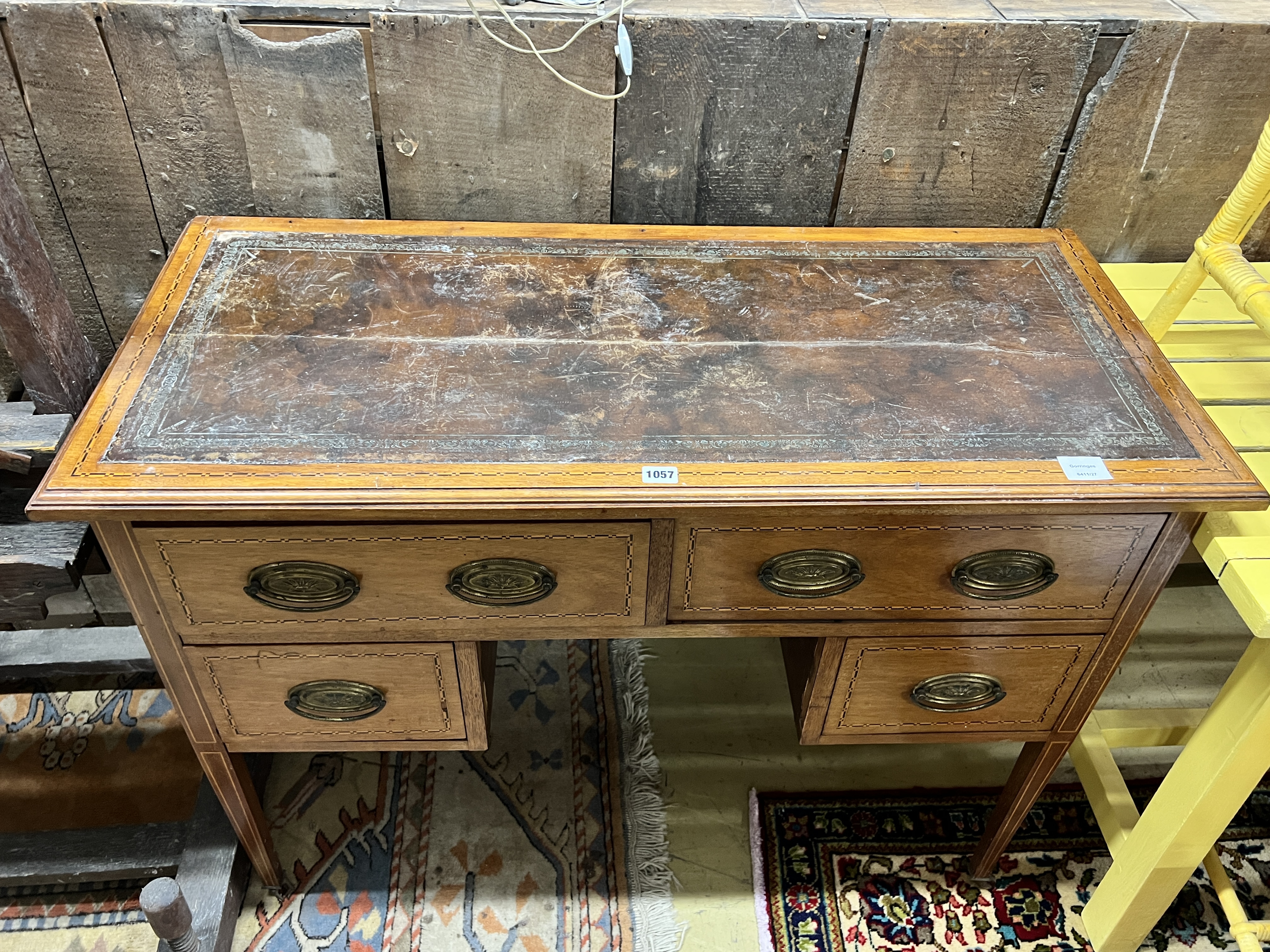 An Edwardian inlaid mahogany kneehole writing table, width 108cm, depth 47cm, height 79cm